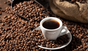 Cup Of espresso Coffee and roasted beans. Coffee background