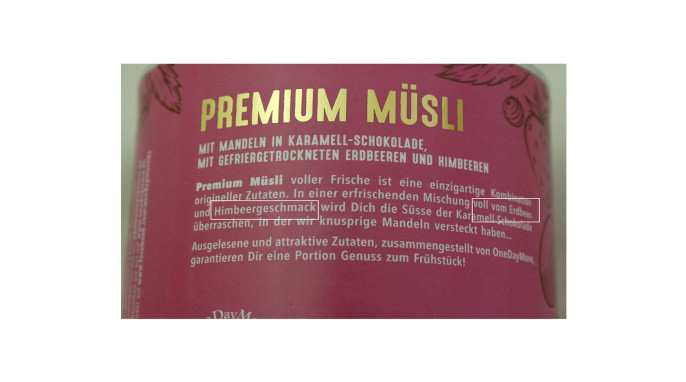 Werbung, OneDayMore Müsli Mandeln in Karamell-Schokolade mit gefriergetrockneten Erdbeeren und Himbeeren