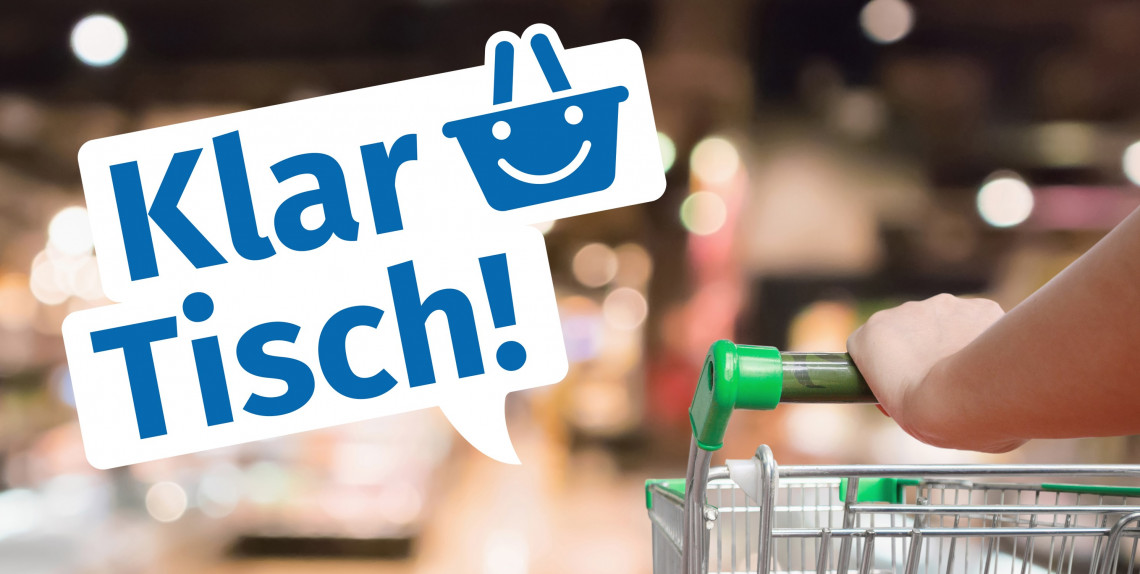 Logo Lebensmittelklarheit "Klar Tisch!" auf einem Foto von einem Einkaufswagen